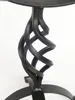A close-up view of the decorative metal base of a garden sundial. Anteprima dell’immagine prodotto
