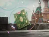 A green and gold deck of cards is floating inside a large bubble, with a castle in the background. Náhled obrázku produktu