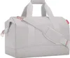 A light gray duffel bag with rose gold accents is shown against a white background. Produktbild-Vorschau