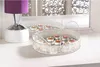 A decorative tray with lit tea lights sits on a white surface next to a lamp. Podgląd zdjęcia produktu