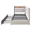A beige upholstered bed frame with a metal support structure and two pull-out drawers. The headboard has a built-in shelf and LED lighting. Náhled obrázku produktu