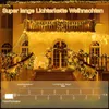 A house decorated with Christmas lights. Produktbild-Vorschau