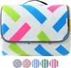A folded picnic blanket with a colorful geometric pattern. Náhled obrázku produktu