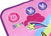 A close-up view of a pink dance mat with colorful graphics and buttons. Produktbild-Vorschau