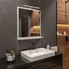 A modern bathroom vanity with a sink, faucet, and mirror. Produktbild-Vorschau