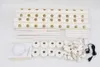 A collection of white pipes and connectors for a hydroponic system, laid out on a white surface. Podgląd zdjęcia produktu