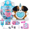 A collection of Zuru Rainbocorns Puppycorn Rescue toys, including a plush puppy, an egg-shaped container, and various accessories. Anteprima dell’immagine prodotto