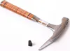 A geologist's hammer with a leather-wrapped handle and a small black wedge are shown on a white background. Produktbild-Vorschau
