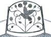 A close-up view of the backrest of a metal garden bench with a hummingbird and floral design. Podgląd zdjęcia produktu