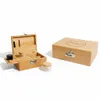 A wooden storage box with a combination lock and accessories, and a separate closed box with the same design. Produktbild-Vorschau