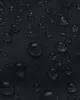 Close-up of water droplets on a black fabric surface. Náhled obrázku produktu