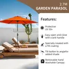 An orange garden parasol is set up over two lounge chairs on a patio. Produktbild-Vorschau