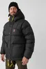 A man wearing a black puffer jacket and a black beanie. Produktbild-Vorschau