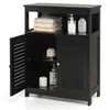 A black wooden bathroom storage cabinet with two doors, one open, displaying various bathroom items. Voir les images du produit