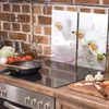 A kitchen scene with a stovetop, cooking utensils, and fresh ingredients. Náhľad obrázku produktu