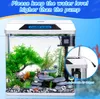 A mini aquarium with decorative elements and a filter system, with text overlay providing instructions. Produktbild-Vorschau