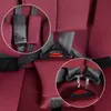 Close-up view of a car seat's harness system, showing the buckle and strap adjusters. Produktbild-Vorschau