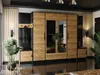 A modern hallway with a large wardrobe, seating, and plants. Produktbild-Vorschau