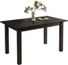A dark brown dining table with a vase of plants and a book on top, set against a white background. Produktbild-Vorschau