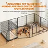 A German Shepherd dog is inside a large, modular dog playpen attached to a dog crate. The playpen has a dog bed and food bowls. Text overlays describe the product. Produktbild-Vorschau