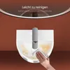 A hand is cleaning a white ceramic sink with a gray faucet, demonstrating its ease of cleaning. Anteprima dell’immagine prodotto