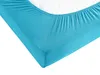 A close-up view of a turquoise fitted sheet on a mattress. Produktbild-Vorschau