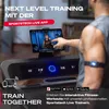 A person using a treadmill with a tablet displaying a fitness app. Produktbild-Vorschau