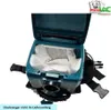 A close-up, top-down view of the inside of a teal backpack vacuum cleaner, showing white filter bags and a pleated filter. Produktbild-Vorschau