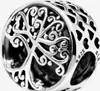 A close-up, studio shot of a silver Pandora charm shaped like a tree of life. Podgląd zdjęcia produktu