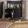 A black kitchen cart with a stainless steel top is shown in a kitchen setting. Produktbild-Vorschau
