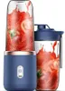 Two portable blenders with tomatoes and juice splashing inside. Podgląd zdjęcia produktu