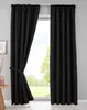 A pair of black curtains tied back with a fabric tie, in front of a window with a view of trees and sky. Produktbild-Vorschau