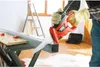 A person is using a Black & Decker reciprocating saw to cut a metal profile on a workbench. A ladder and a tool case are visible in the background. Anteprima dell’immagine prodotto
