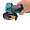 A hand holding a mini angle grinder with a cutting wheel attached. Náhled obrázku produktu