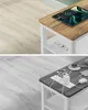 Two split images showing charging devices on side tables. The top image features a tablet and phone charging on a wooden-topped table with a white frame, which has built-in power outlets. The bottom image shows a power strip, charging brick, earbuds, and s Náhled obrázku produktu