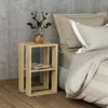 A bedside table next to a bed in a bedroom. Náhľad obrázku produktu