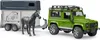 A green toy Land Rover Defender towing a gray and white horse trailer with a black toy horse. Produktbild-Vorschau
