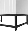Close-up of the base of a white cabinet with a black metal frame and legs. Anteprima dell’immagine prodotto