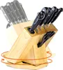A knife block set with knives and scissors displayed on a white background. The knife block is made of wood and has a rotating base. Náhľad obrázku produktu