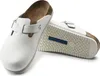 A pair of white Birkenstock clogs on a white background. Produktbild-Vorschau