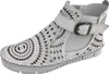A single white boot with intricate cut-out patterns and a buckle strap, displayed against a plain white background. Anteprima dell’immagine prodotto