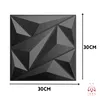 A black 3D geometric wall panel is shown with dimensions indicated. Produktbild-Vorschau