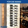 A metal wine rack mounted on a textured wall, filled with wine bottles. Another rack of wine bottles is visible in the background. Produktbild-Vorschau