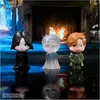 Three chibi-style figures of Harry Potter characters standing in front of a fireplace. Voir les images du produit