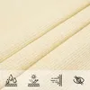 A close-up view of a cream-colored fabric, likely a sun sail, with icons at the bottom indicating water resistance, UV protection, and breathability. Produktbild-Vorschau