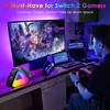 A person is playing a video game in a room with multiple screens and colorful lighting. Produktbild-Vorschau