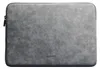 A gray laptop sleeve with a zipper. Anteprima dell’immagine prodotto