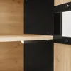 A close-up view of a wooden and black cabinet shelf. Voir les images du produit
