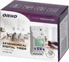 The image shows the packaging of an astronomical digital timer. The packaging features a lifestyle image of a dining room and a product shot of the timer itself. Náhled obrázku produktu