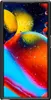 A smartphone with a colorful, abstract wallpaper displaying the time. Náhled obrázku produktu